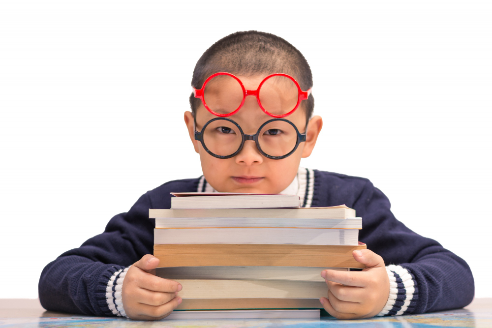 Smart looking kid wearing two glasses