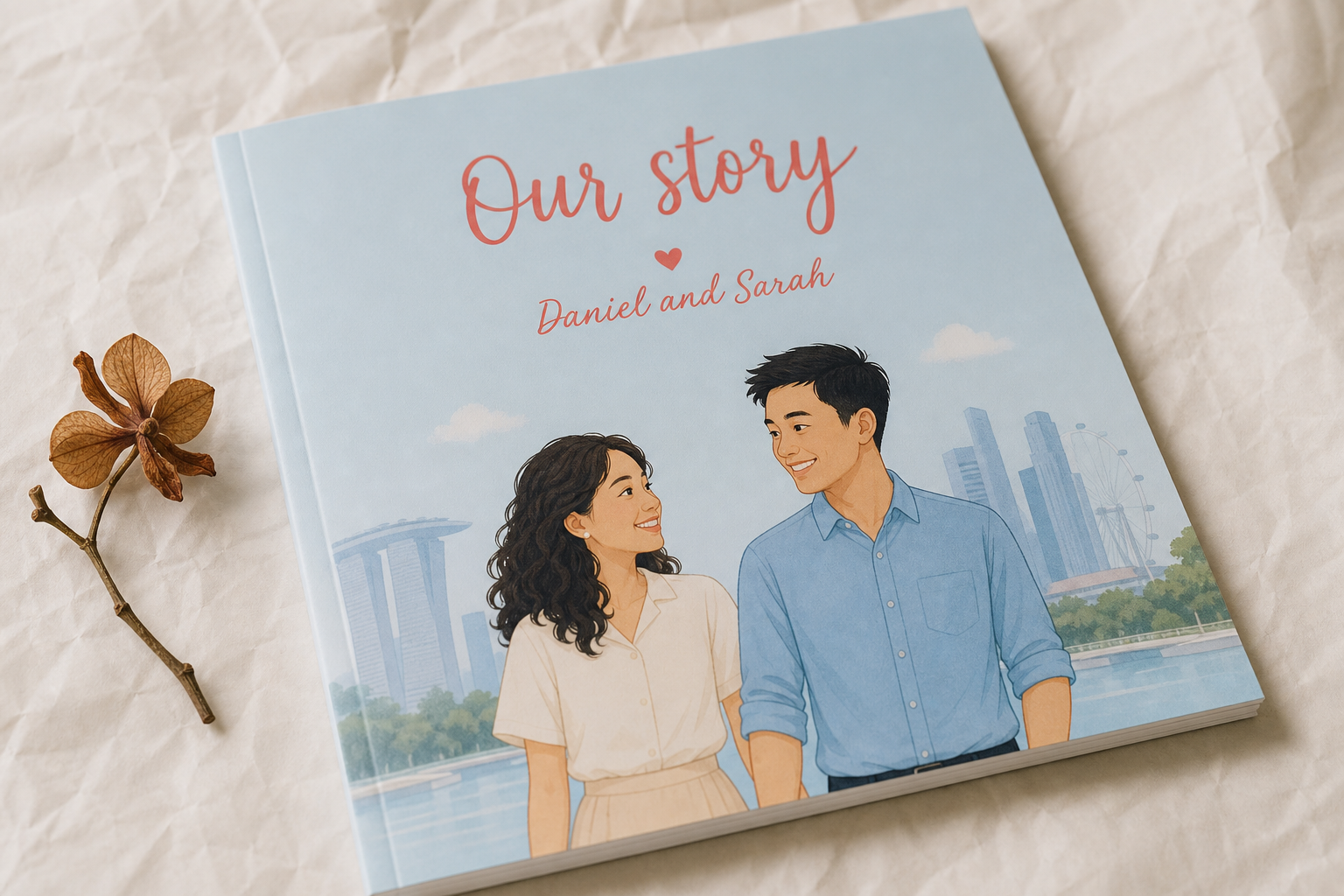 Macro close-up of the personalised picture book cover showing 'Our story · Daniel and Sarah' with a flat-illustration of the cartoon couple.